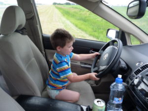 Child in Toyota driver's seat.